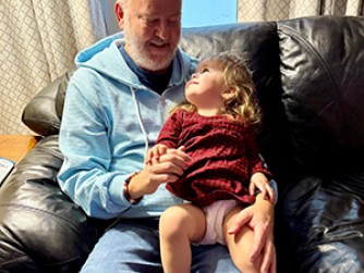 Dennis with granddaughter